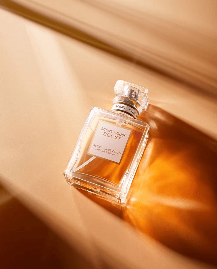 Glass fragrance bottle in warm light